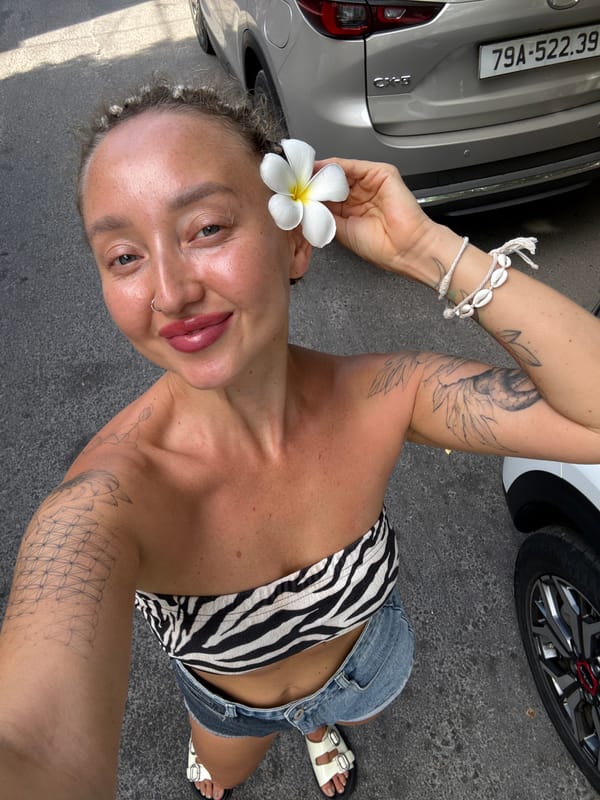 Selfie and parked SUV outside a Nha Trang commercial spot