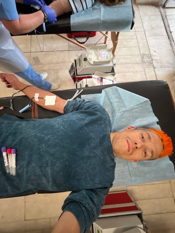 Morning scenes captured in Chaikovsky: blood donation, school gathering, spring blooms