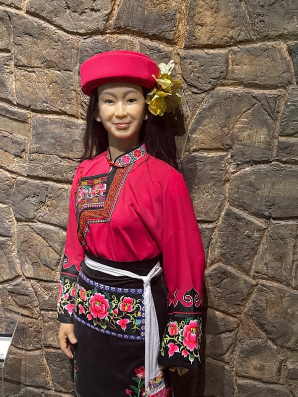 Museum visitor documents cultural exhibits in Yuzhong District