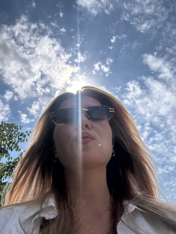 Sunny selfies and architecture outside a modern brick building
