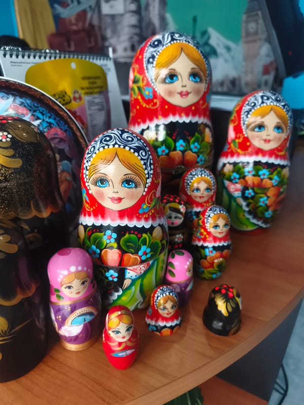 Russian nesting dolls displayed on wooden surface in Thailand