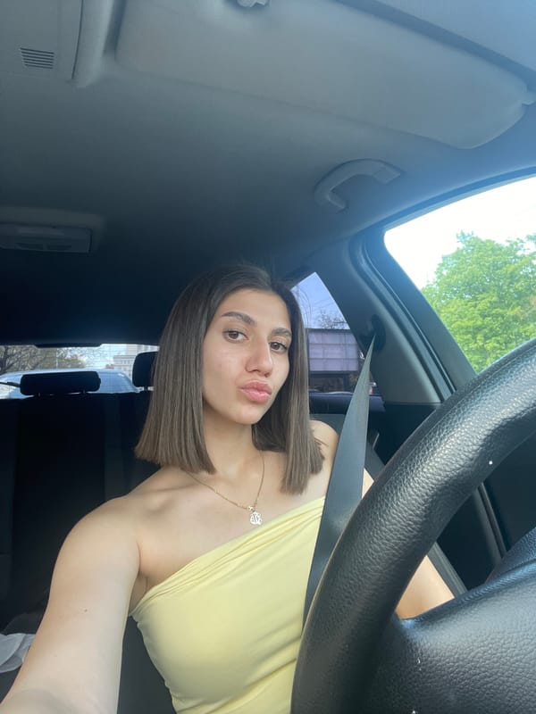 Woman takes playful car selfies in Sofia