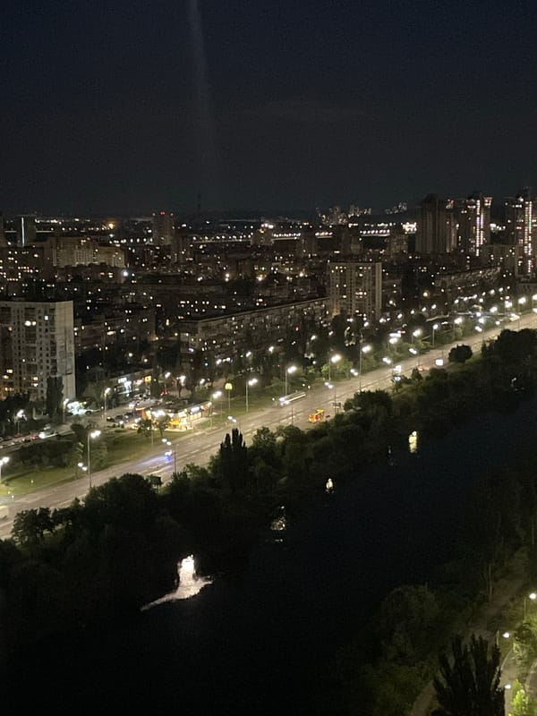 Kyiv from above at night, full moon over the Dnipro