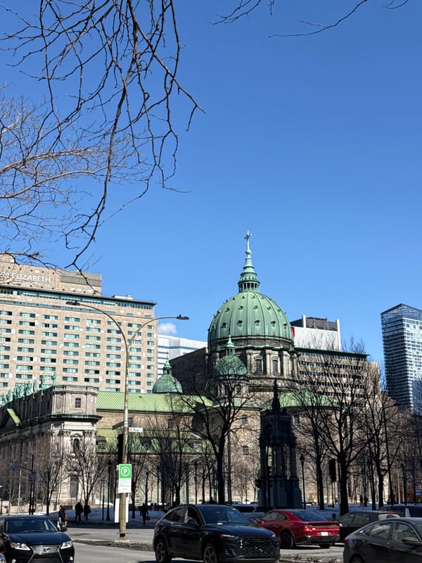Montreal street intersection with cathedral and traffic captured