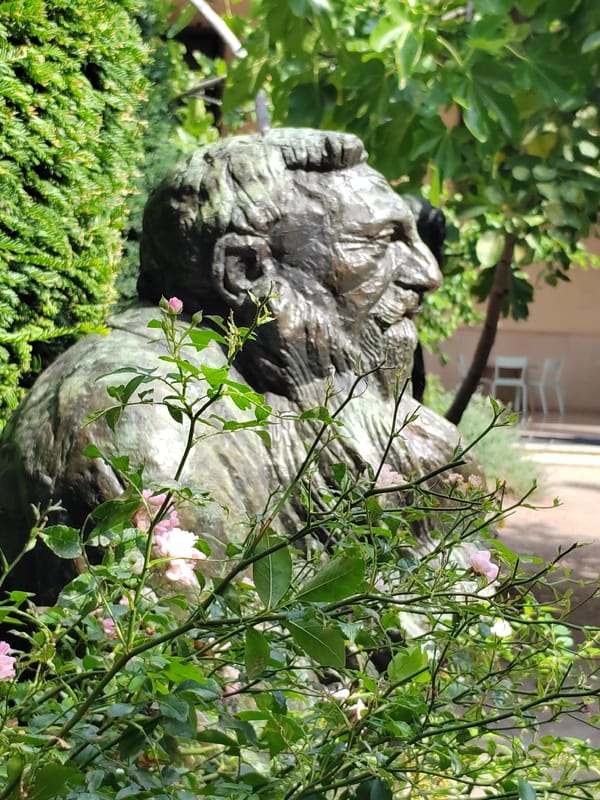 Bronze sculpture collection spanning busts, figures, and equestrian works outdoors
