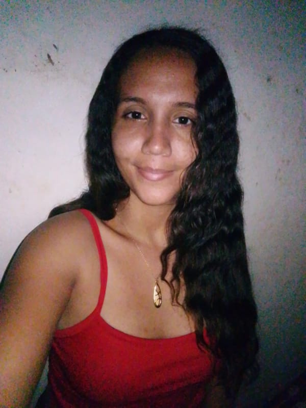 Woman documents selfie session with pet in Venezuelan coastal town