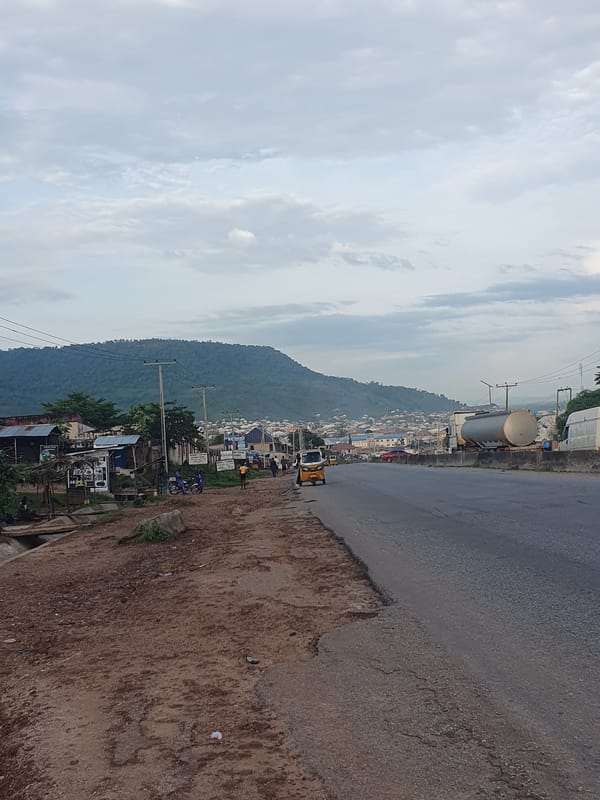 Daily street life and motorcycle traffic in Lokoja, Nigeria