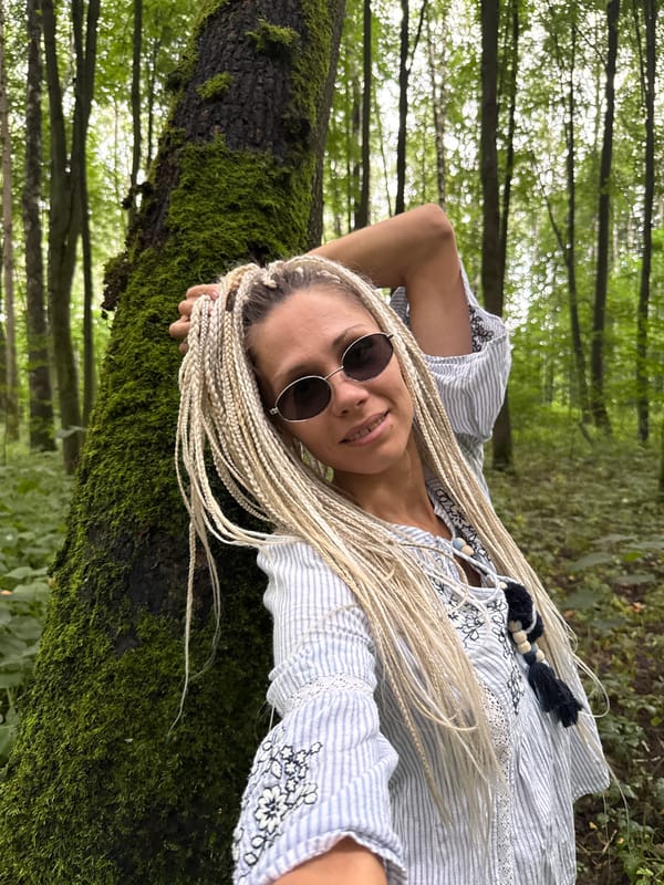 Summer park portraits in a Russian forest, braids and stripes.