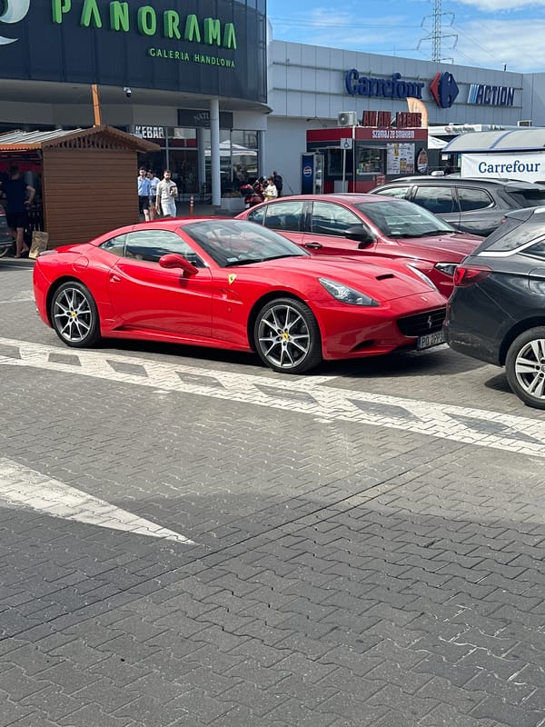 Red Ferrari parked outside Poznań's Panorama shopping center