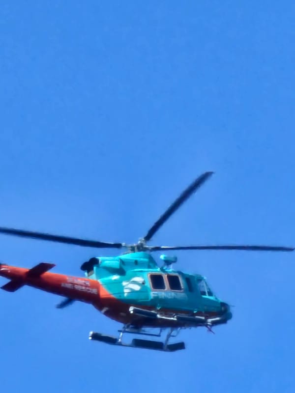 Kiteboards, helicopters, and cruise ships off the Bali coast