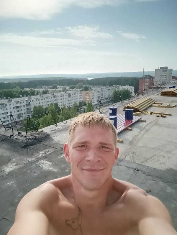 Rooftop selfie session above a city skyline