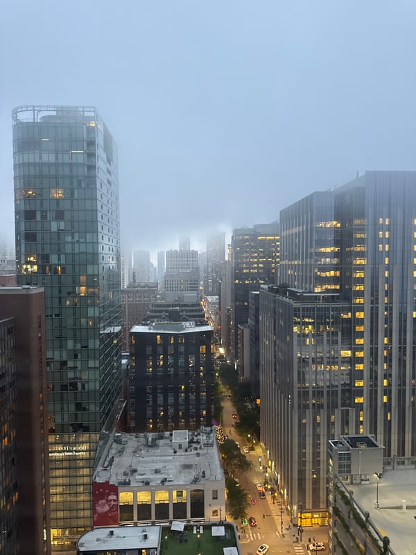 Chicago skyline glows through late-night fog