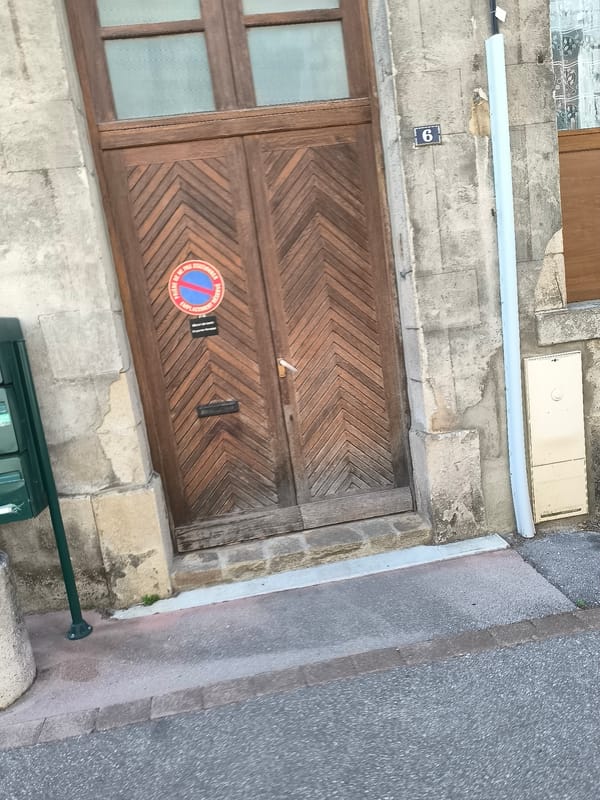 Pedestrian documents casual walk through Pélussin neighborhood streets