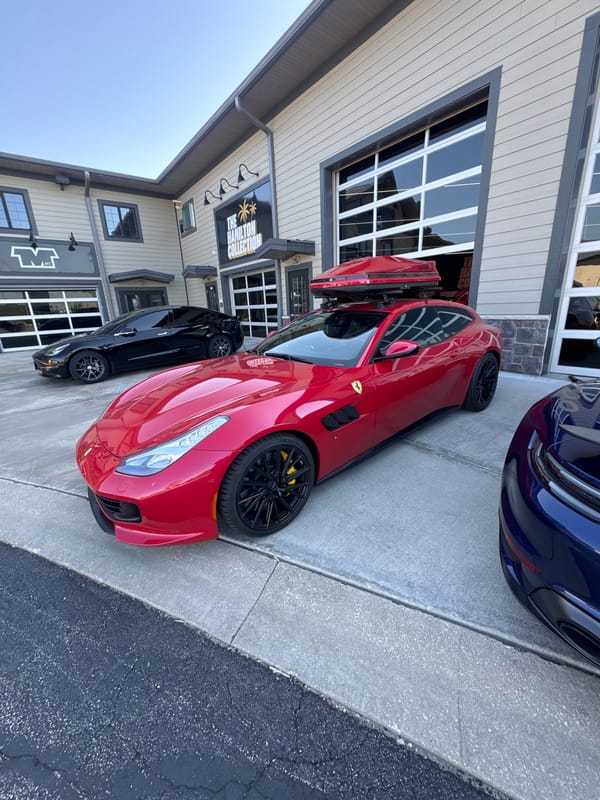 Luxury car dealership showcases multiple sports vehicles in Naperville