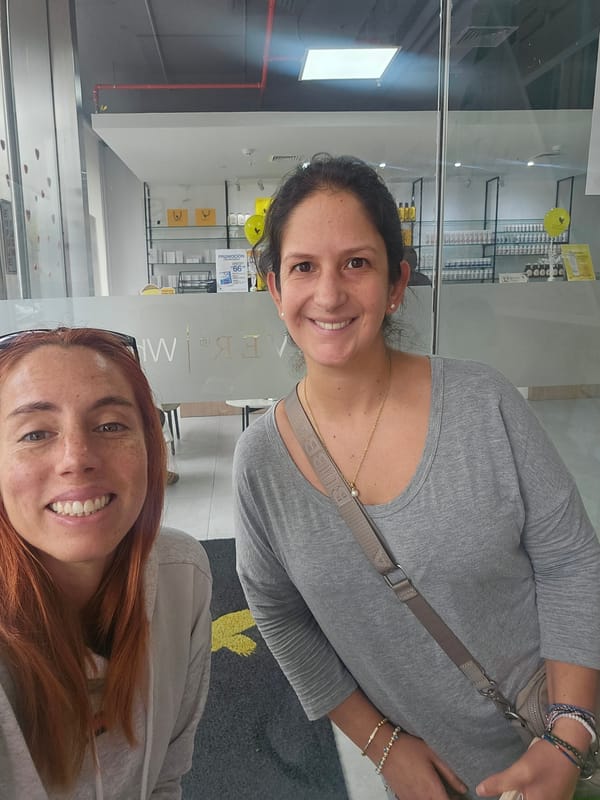 Two women meet in San Isidro business setting