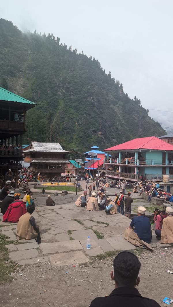 Community gathering in Malana's traditional mountain village