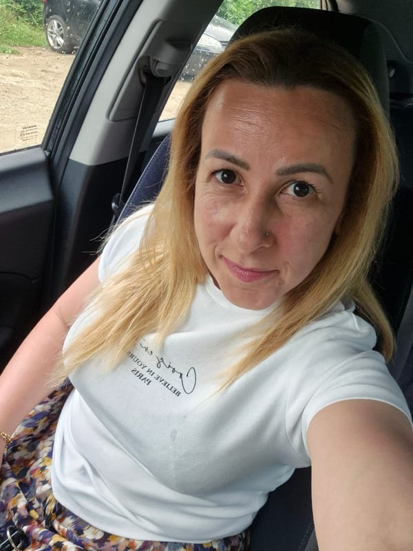 Blonde woman photographed in car and outdoor selfies