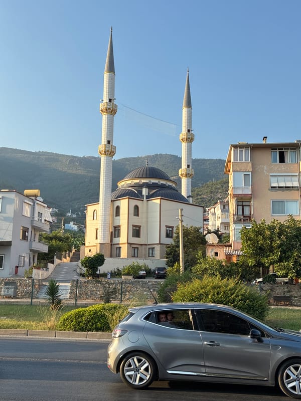 Sunny afternoon street scene near a mosque in Alanya