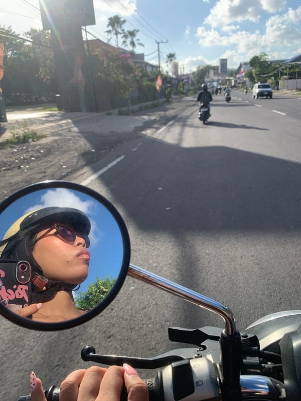 Weekday morning traffic rolling through Denpasar streets