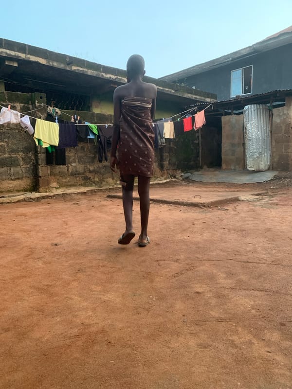 Daily life in a Shagamu courtyard — chores, fire, and portraits