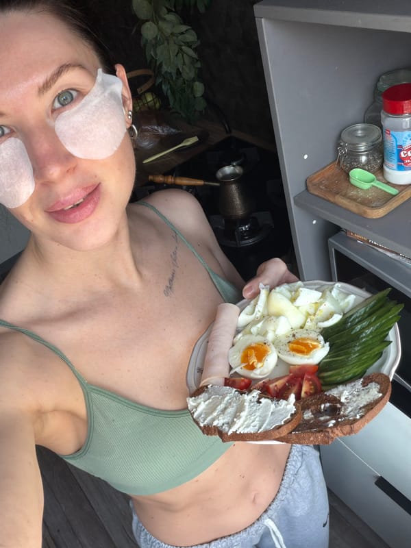 Woman takes mirror selfie in workout clothes in Perm
