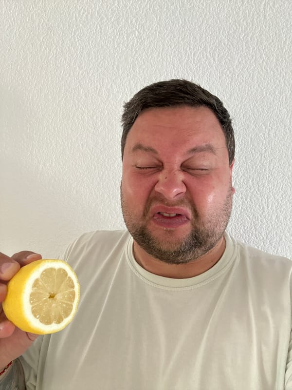Man tastes lemon in Spanish coastal town fruit display