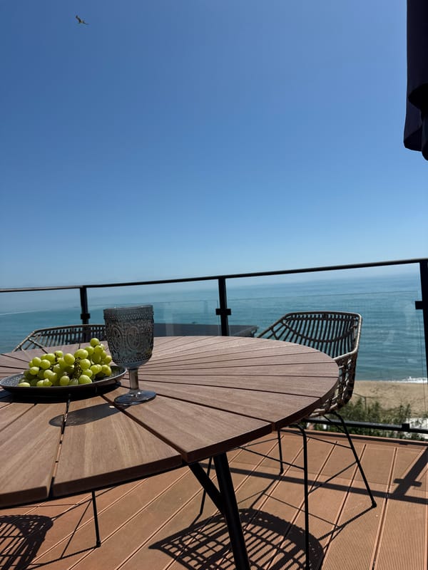 Morning deck dining scene overlooking Black Sea in Varna