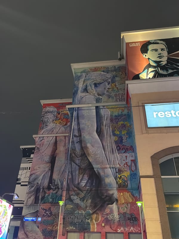 Moscow building facade features vibrant murals and graffiti art