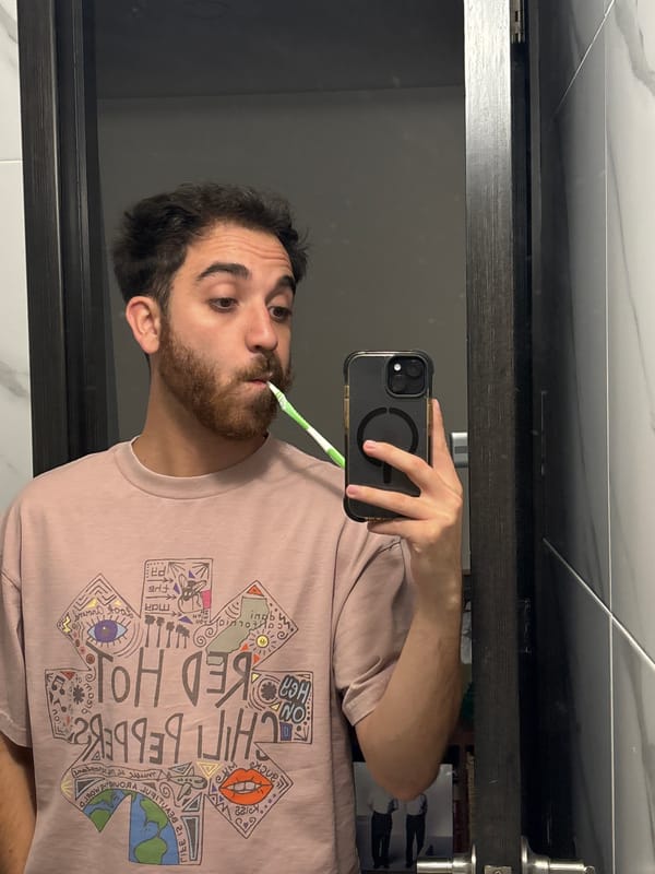 Man takes bathroom selfie while brushing teeth in Mexico
