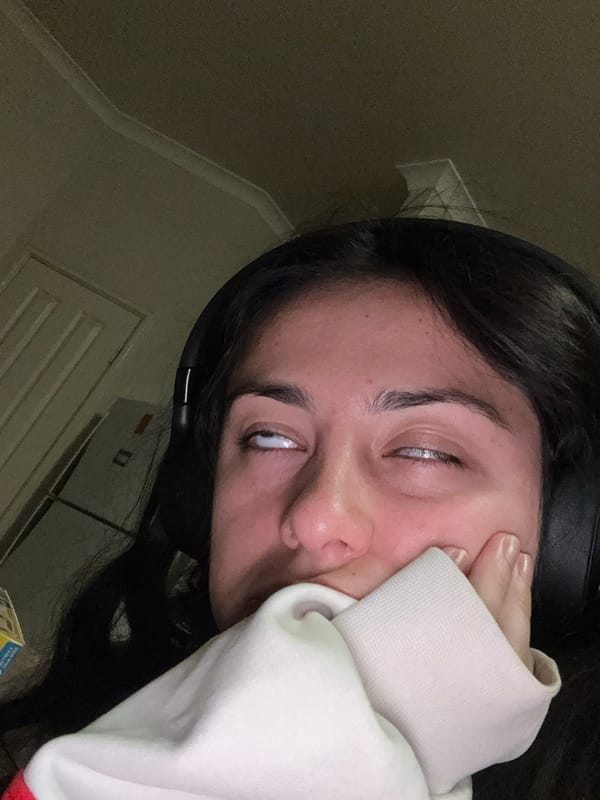 Woman rests at kitchen counter in Como, Australia
