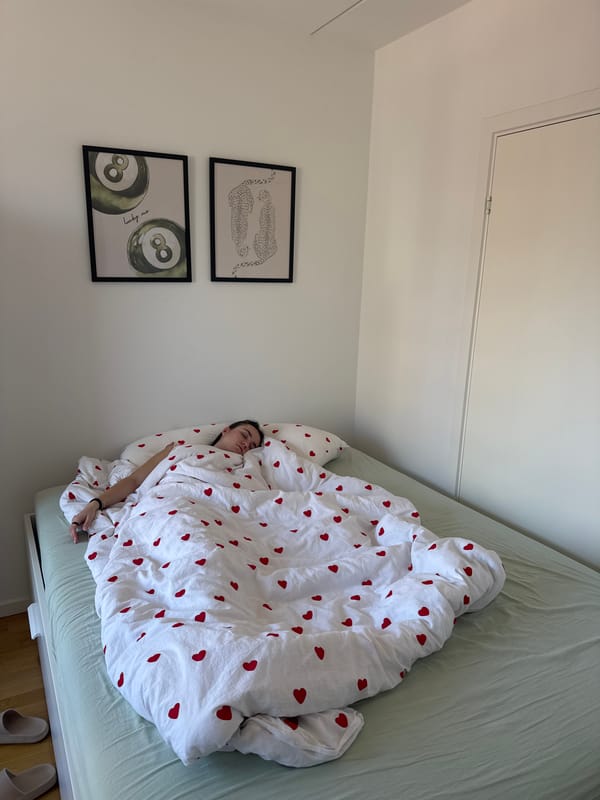 Woman rests in decorated bedroom in Copenhagen