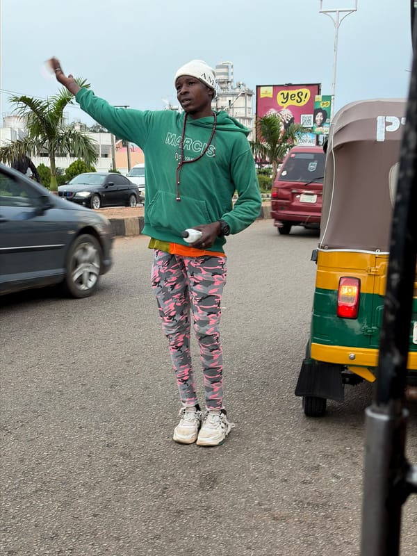 Standing on a paved road in Jos, Nigeria