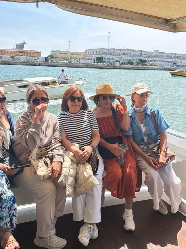 Venice visitors enjoy boat ride, sunglasses moment captured