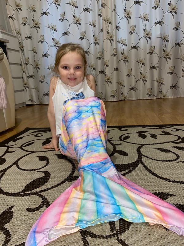 Child plays on couch in Votkinsk home