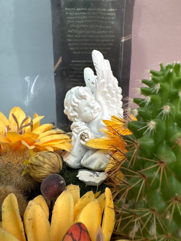 Decorative displays featuring cherub statue and ship model observed in Burgas