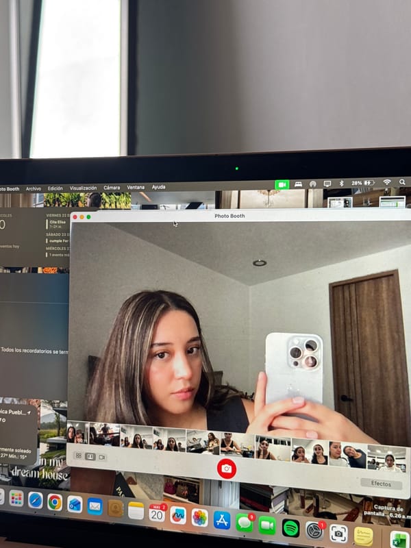 Woman takes iPhone selfies via MacBook Photo Booth in Puebla