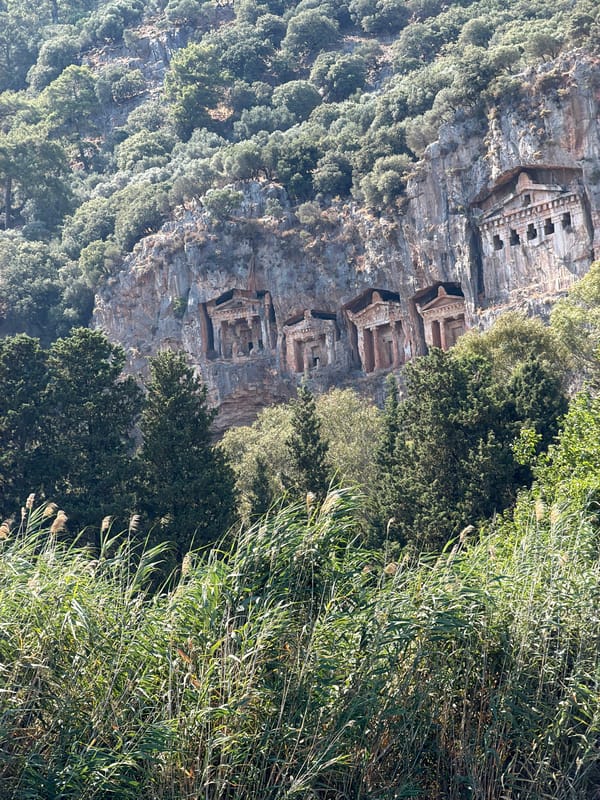 Ancient Lycian cliff tombs carved into rock face, Dalyan