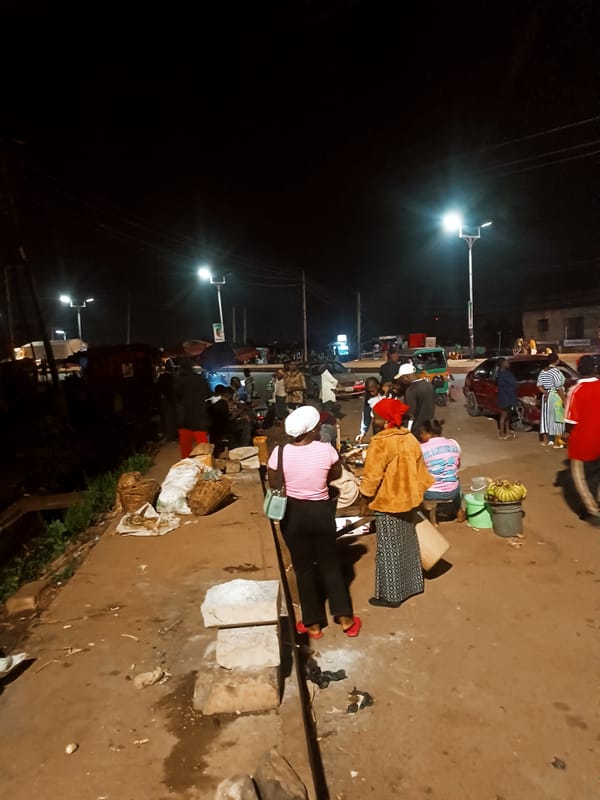 Evening street life and commerce documented in Bukuru, Nigeria