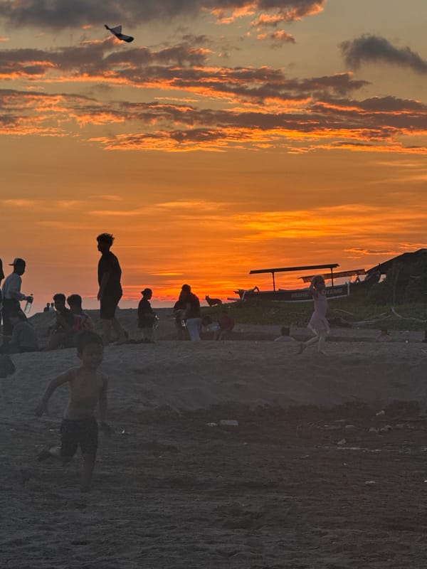 Kite flying and beach activities observed in North Kuta