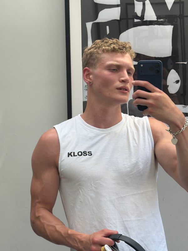Person takes selfie wearing KLOSS shirt in London