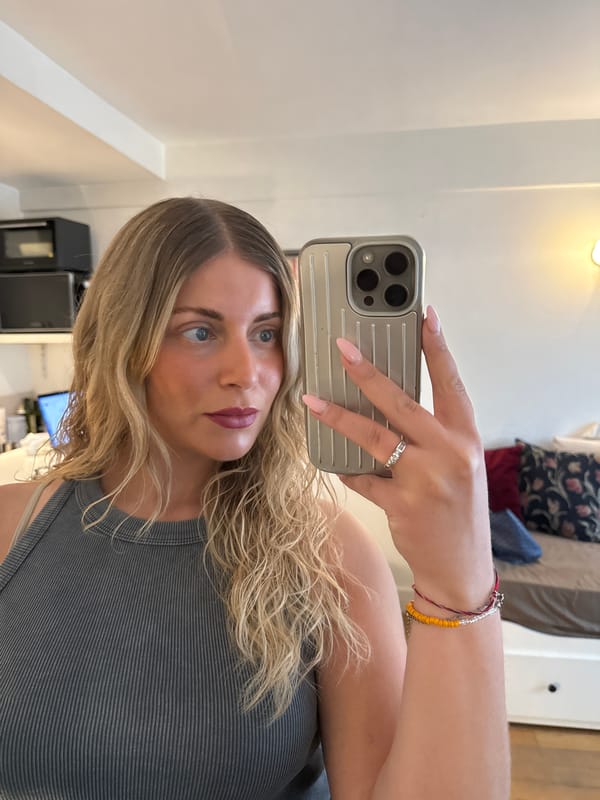 Woman takes selfie session in Paris studio apartment