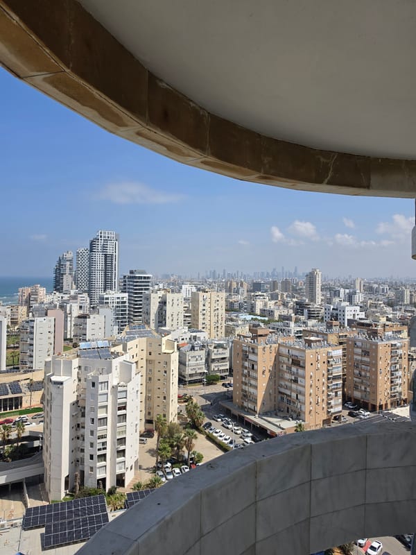 Aerial view captures Bat Yam cityscape and coastline
