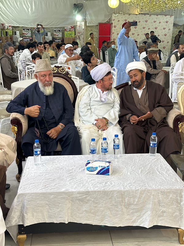 Traditional gathering of men in formal attire, Quetta