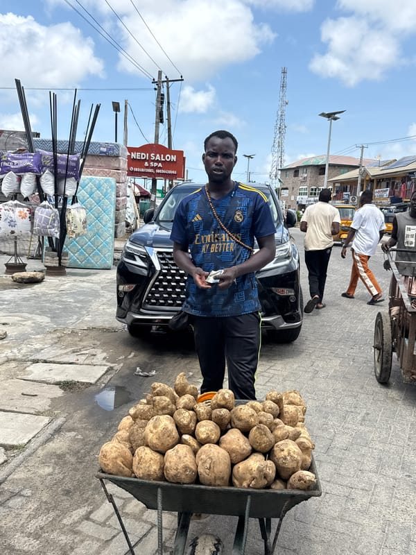Daily street commerce and repairs observed in Ado, Nigeria