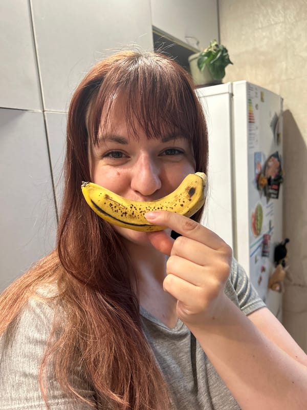 Woman poses with book and banana in Russian town