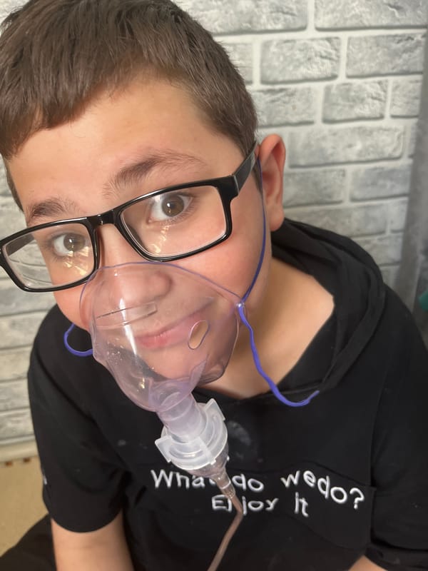 Mother documents baby's nebulizer treatment in intimate family photos