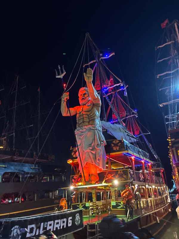 Alanya's harbor at night: pirate boats, street life, neon glow