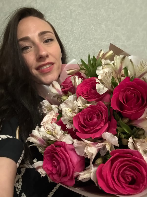 Woman poses with flower bouquets across Saint Petersburg locations