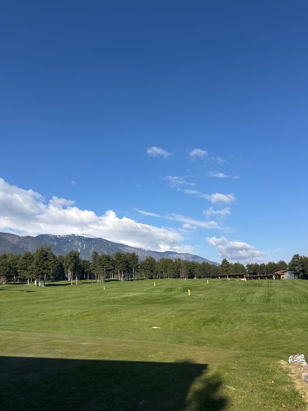 Morning views captured in Razlog, Bulgaria show mountains, golf facility