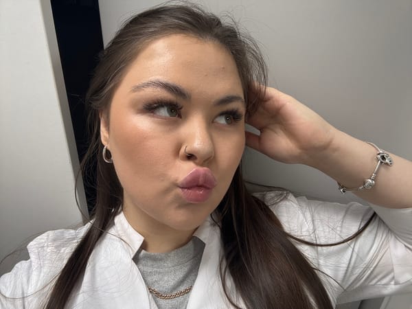 Woman applies skincare cream during morning routine in Pargolovo